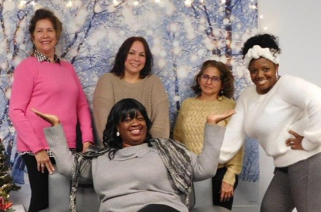 The Greater Bridgeport Home Visiting Partnership team at a recent Winter Wonderland photoshoot for families in the program..
